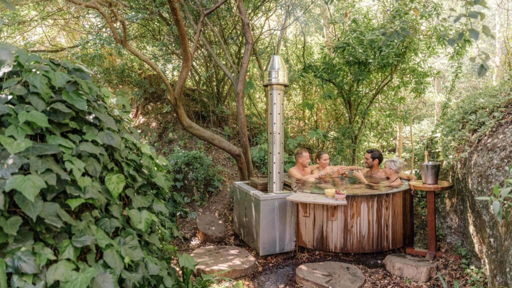 Friends spending time together in a Buitengewoon wood-fired hot tub