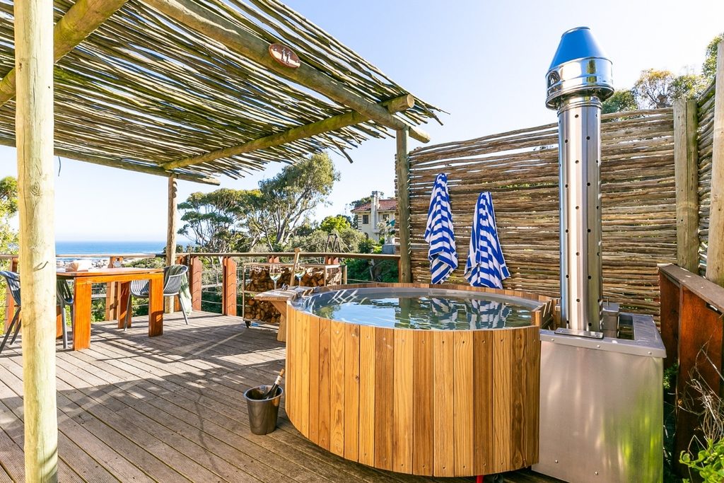 Buitengewoon wood-fired hot tub on a private deck overlooking Camps Bay
